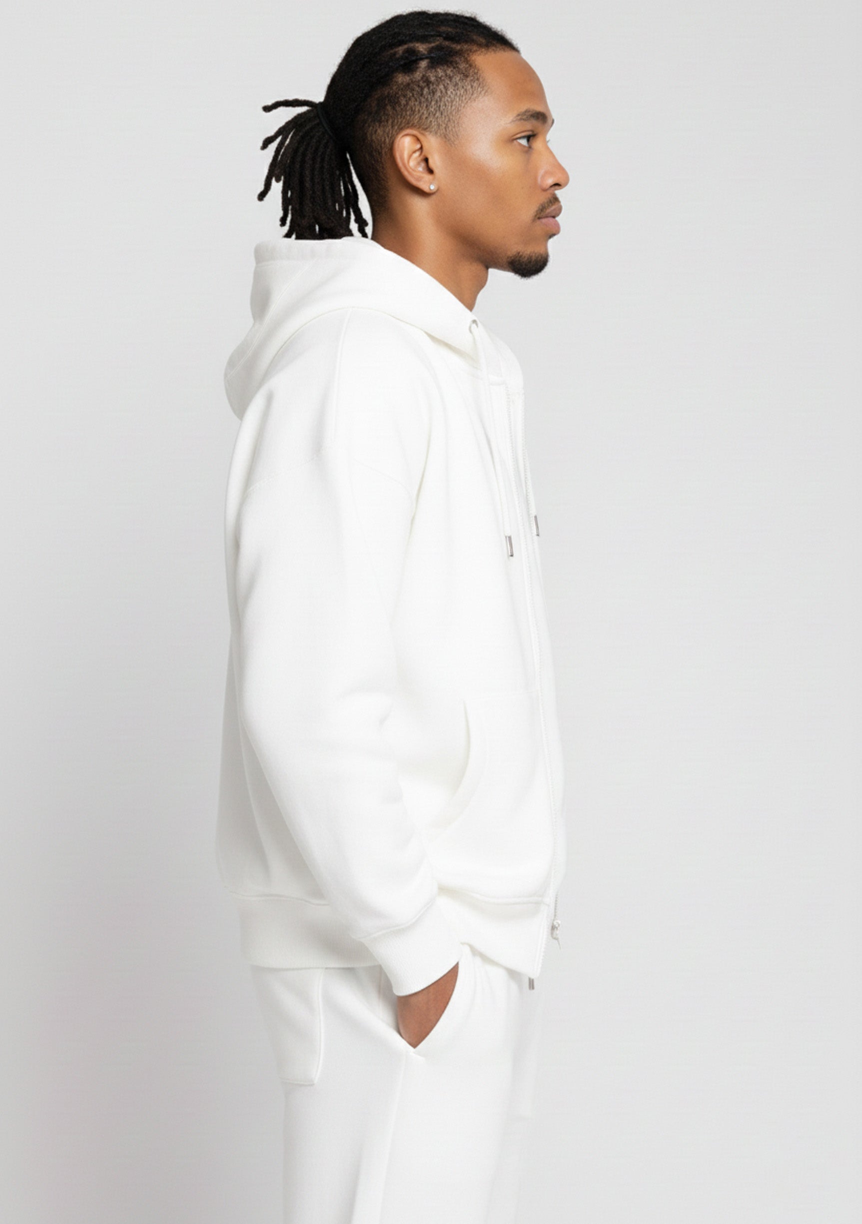 Side profile close up of the Herman men's white zip hoodie showcasing the soft fabric and fit