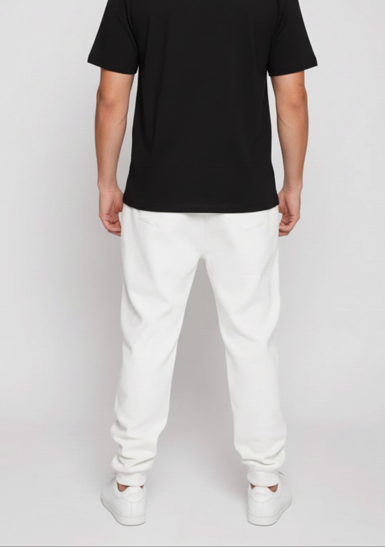 Back view of the Herman men's white tapered joggers showcasing the clean design and fit
