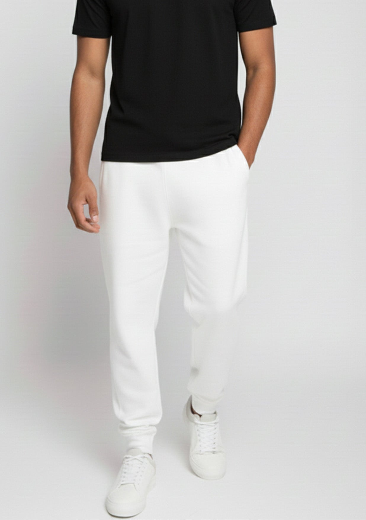 Angled front view of the Herman men's white tapered joggers highlighting the soft jersey fabric