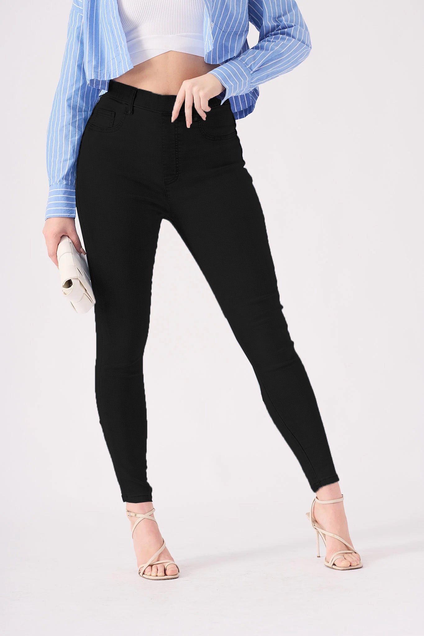 Front view of high waisted black jeggings showing the sleek skinny fit.