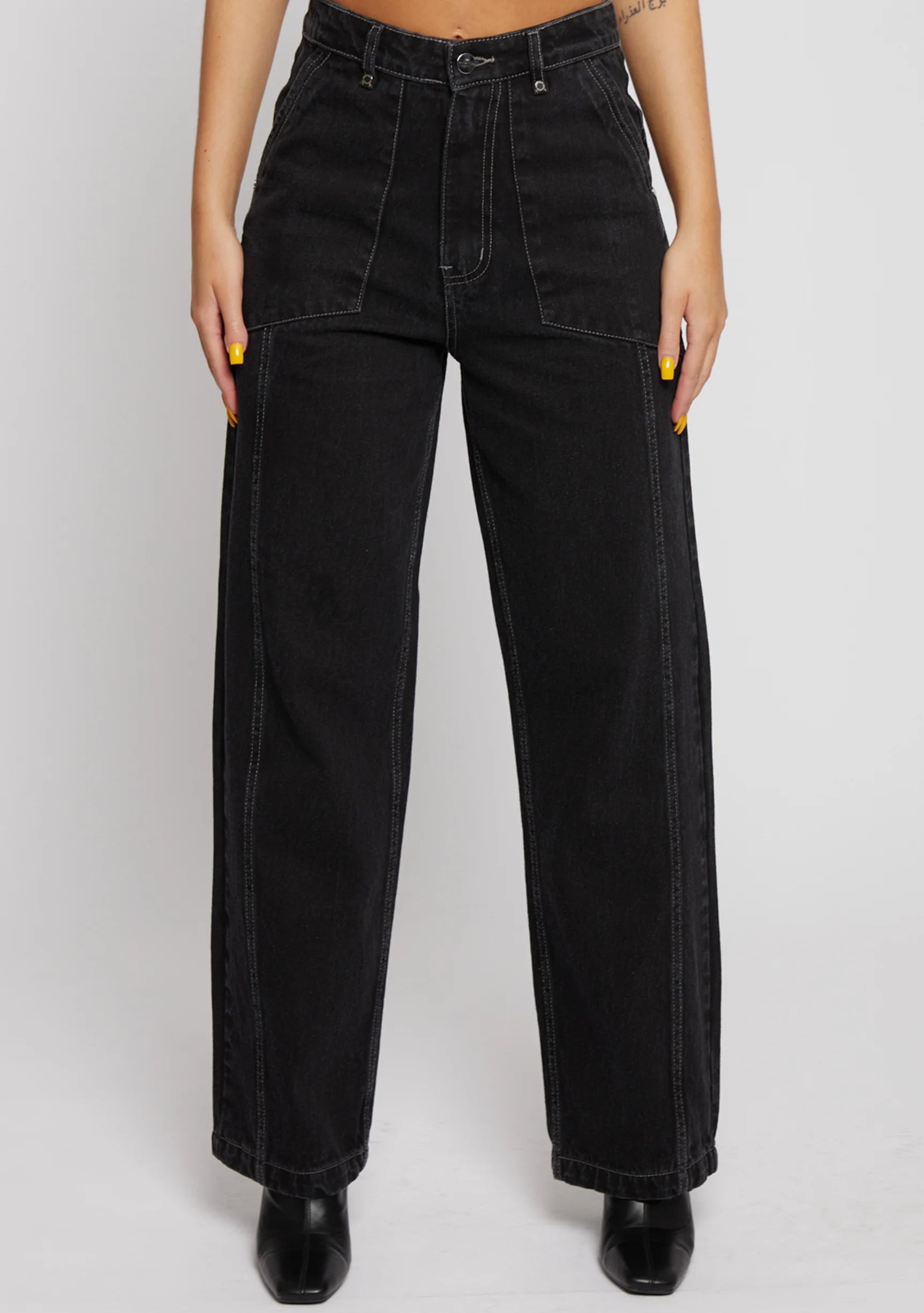 Direct front view of high-waist wide-leg jeans featuring front patch pockets and belt loops.