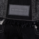 Jmojo black contrast denim jacket Herman and Co vegan leather patch close up