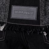 Jmojo black contrast denim jacket Herman and Co vegan leather patch close up