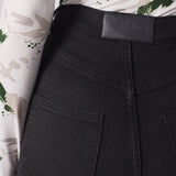 Jmojo black skinny jeans back waist close up vegan leather badge