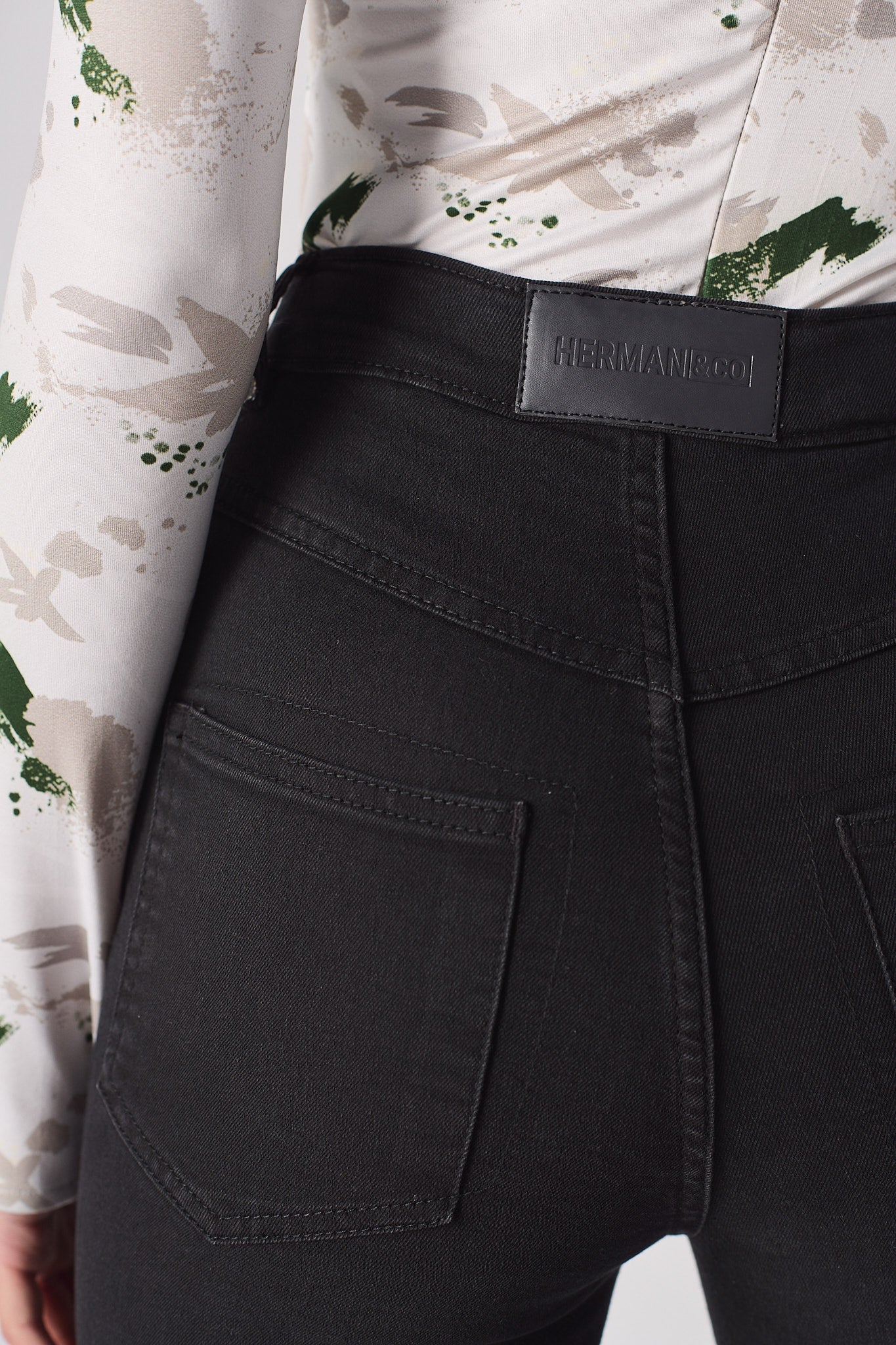 Jmojo black skinny jeans back waist close up vegan leather badge
