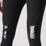 Jmojo black ripped skinny jeans close up lace under print knee panels