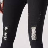 Jmojo black ripped skinny jeans close up lace under print knee panels