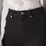 Jmojo black skinny jeans close up waist button and hardware detail