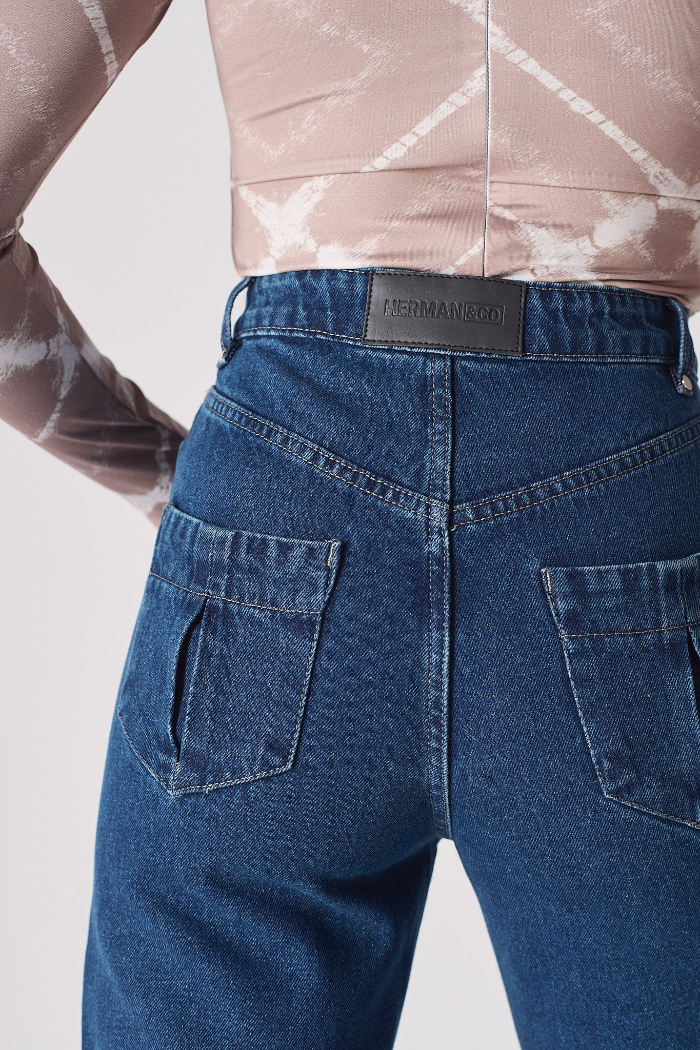 Jmojo dark wash straight leg jeans back pocket and vegan leather branding detail