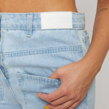 Jmojo distressed straight leg jeans logo patch and pocket close up detail