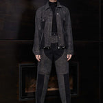 Model wearing Jmojo black acid wash heart panel tapered jeans with matching denim jacket full length