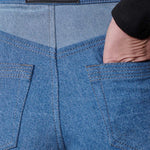 Close up of Herman and Co vegan leather branding patch and back pockets on blue wash tapered jeans