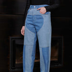 Close up front view of Jmojo heart panel tapered jeans blue wash on model