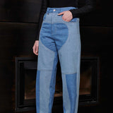Close up front view of Jmojo heart panel tapered jeans blue wash on model