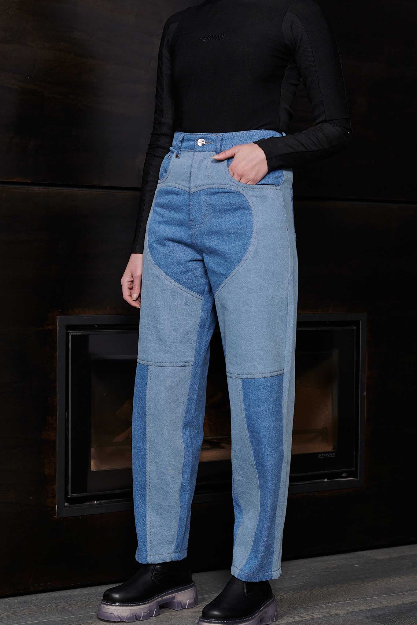 Close up front view of Jmojo heart panel tapered jeans blue wash on model