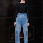 Model wearing Jmojo heart panel tapered fit jeans in contrasting blue wash full length view