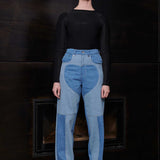 Model wearing Jmojo heart panel tapered fit jeans in contrasting blue wash full length view