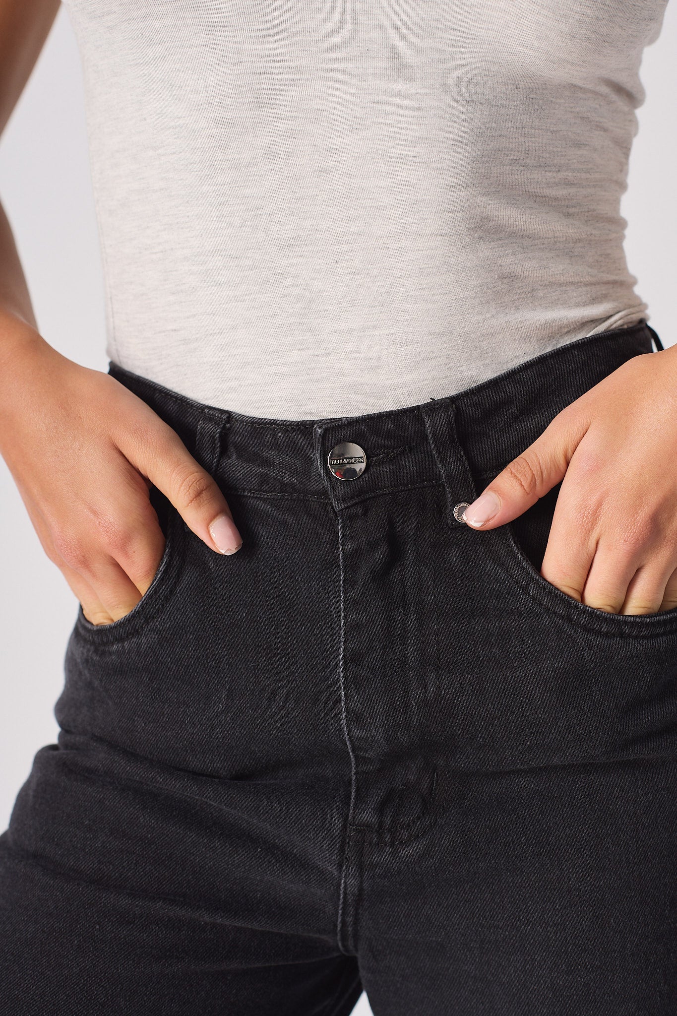 Jmojo high waisted black straight leg jeans waistband and coin pocket close up