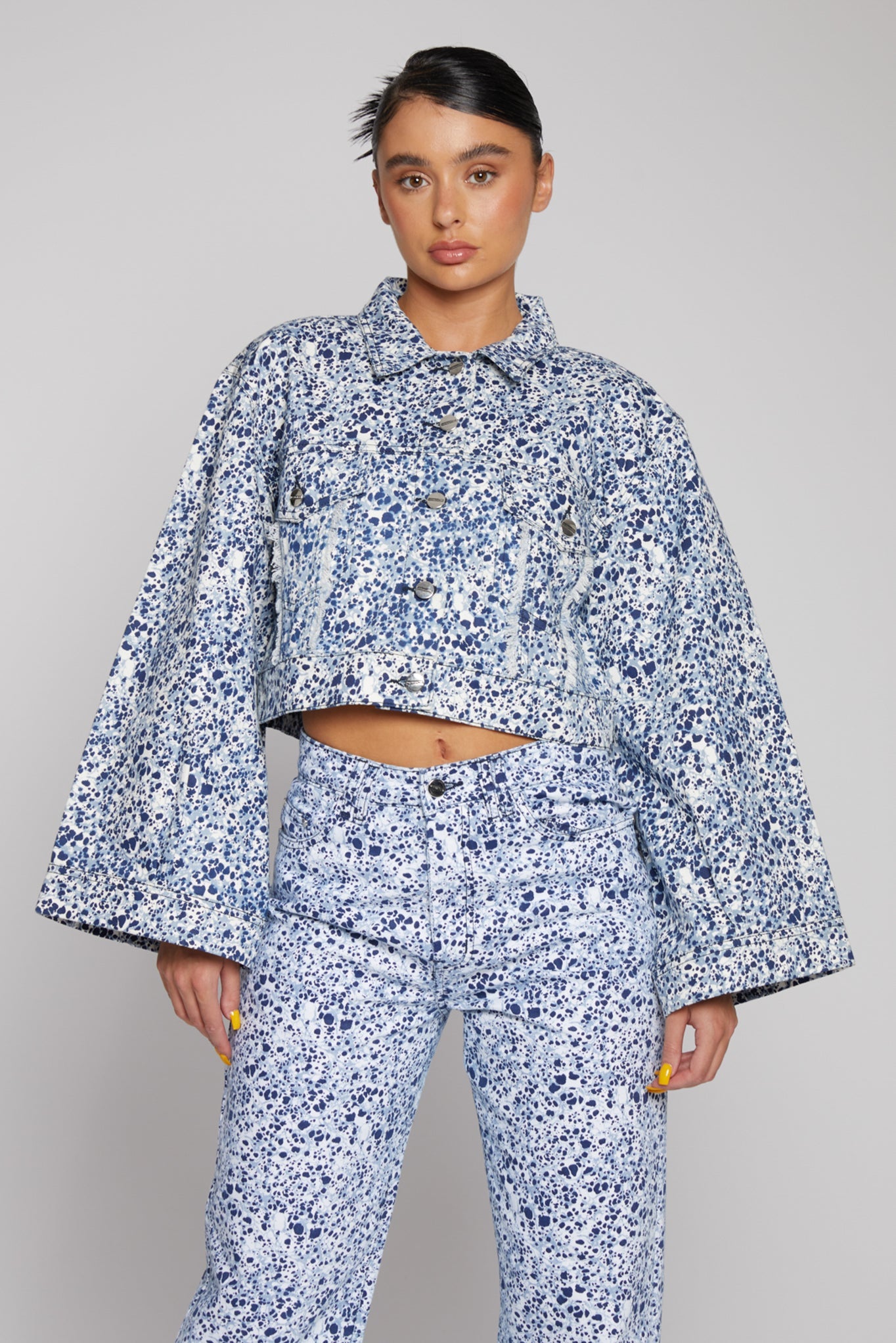 Jmojo marble print cropped denim jacket front close up showing wide flared sleeves