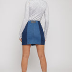 Jmojo high waist patchwork denim mini skirt back view on model with white boots