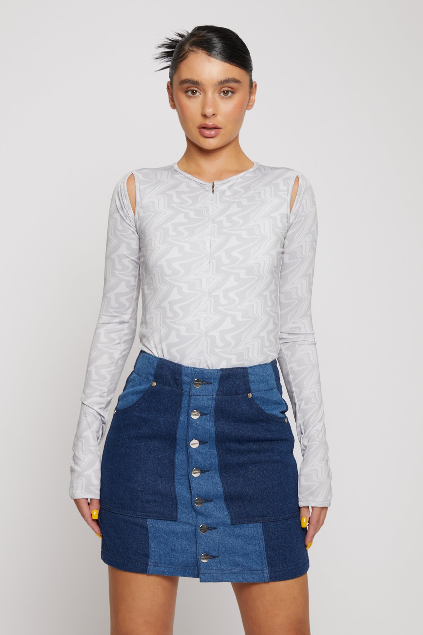 Jmojo patchwork denim mini skirt worn with grey long sleeve top full front view