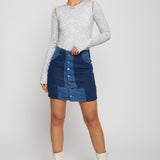 Jmojo high waist patchwork denim mini skirt front view model pose with white boots