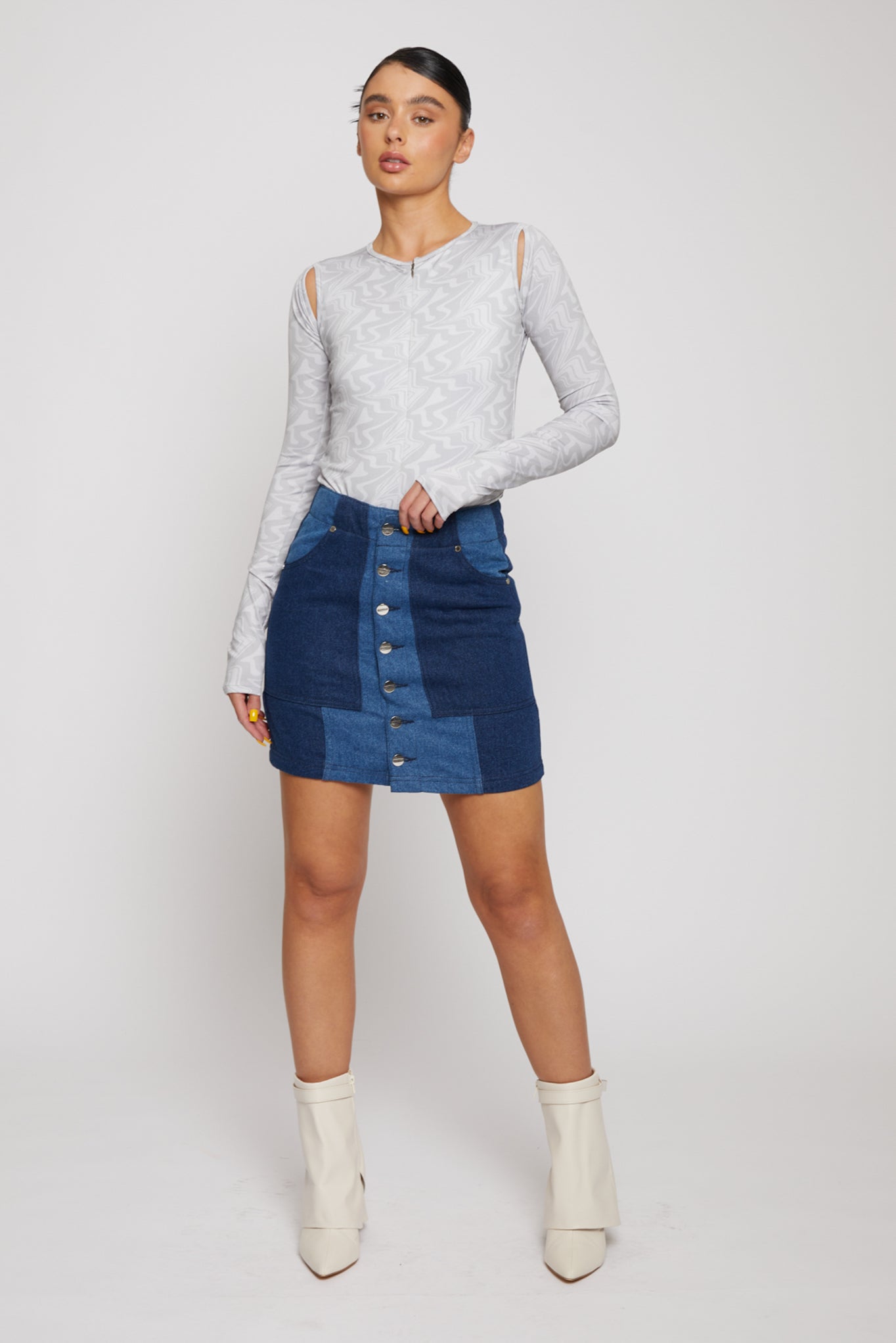 Jmojo high waist patchwork denim mini skirt front view model pose with white boots