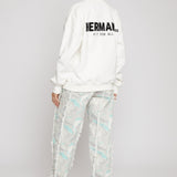 Jmojo printed straight leg jeans marble mint worn with white sweatshirt back view