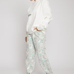 Jmojo printed straight leg jeans marble mint worn with white sweatshirt side view