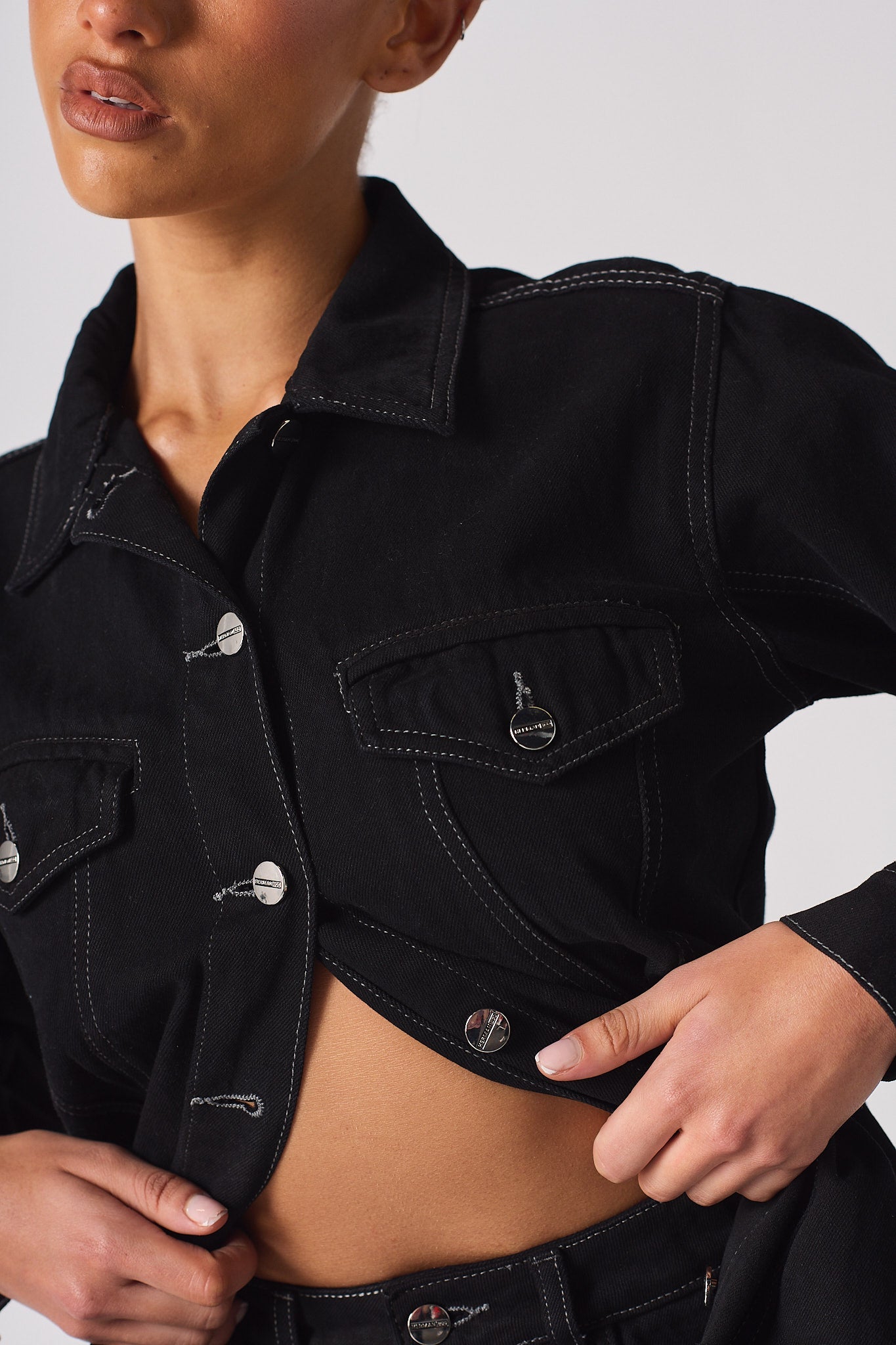 Jmojo tapered waist black denim jacket button and chest pocket close up