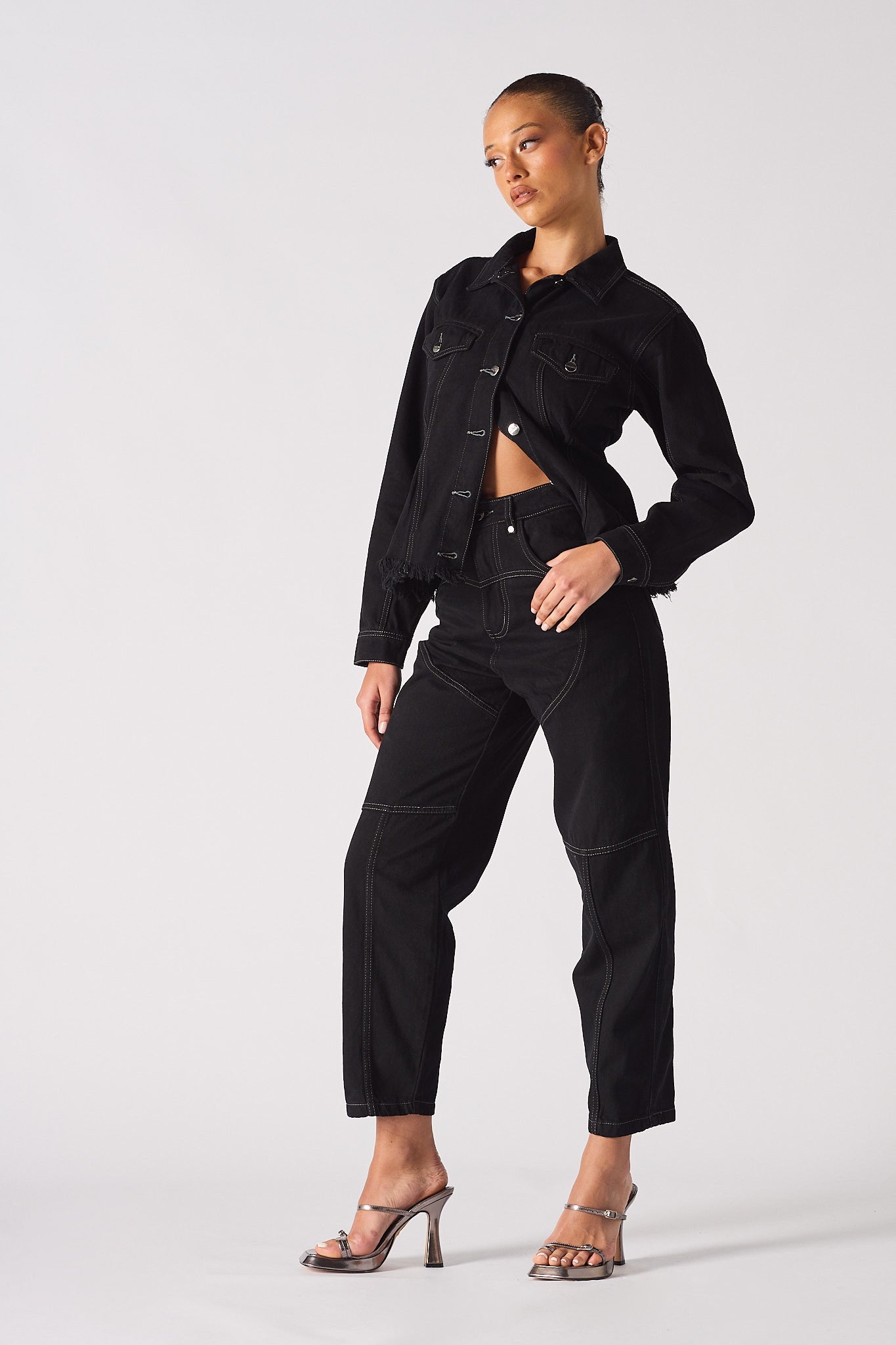 Jmojo tapered waist black denim jacket model angled side view