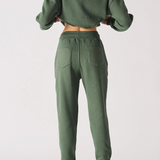 Rear view showing the relaxed fit of these khaki green joggers women.