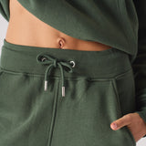 Close up of the adjustable drawstring waist on khaki green joggers women.