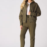 Full front view of a khaki zip up sweatshirt paired with matching cuffed joggers