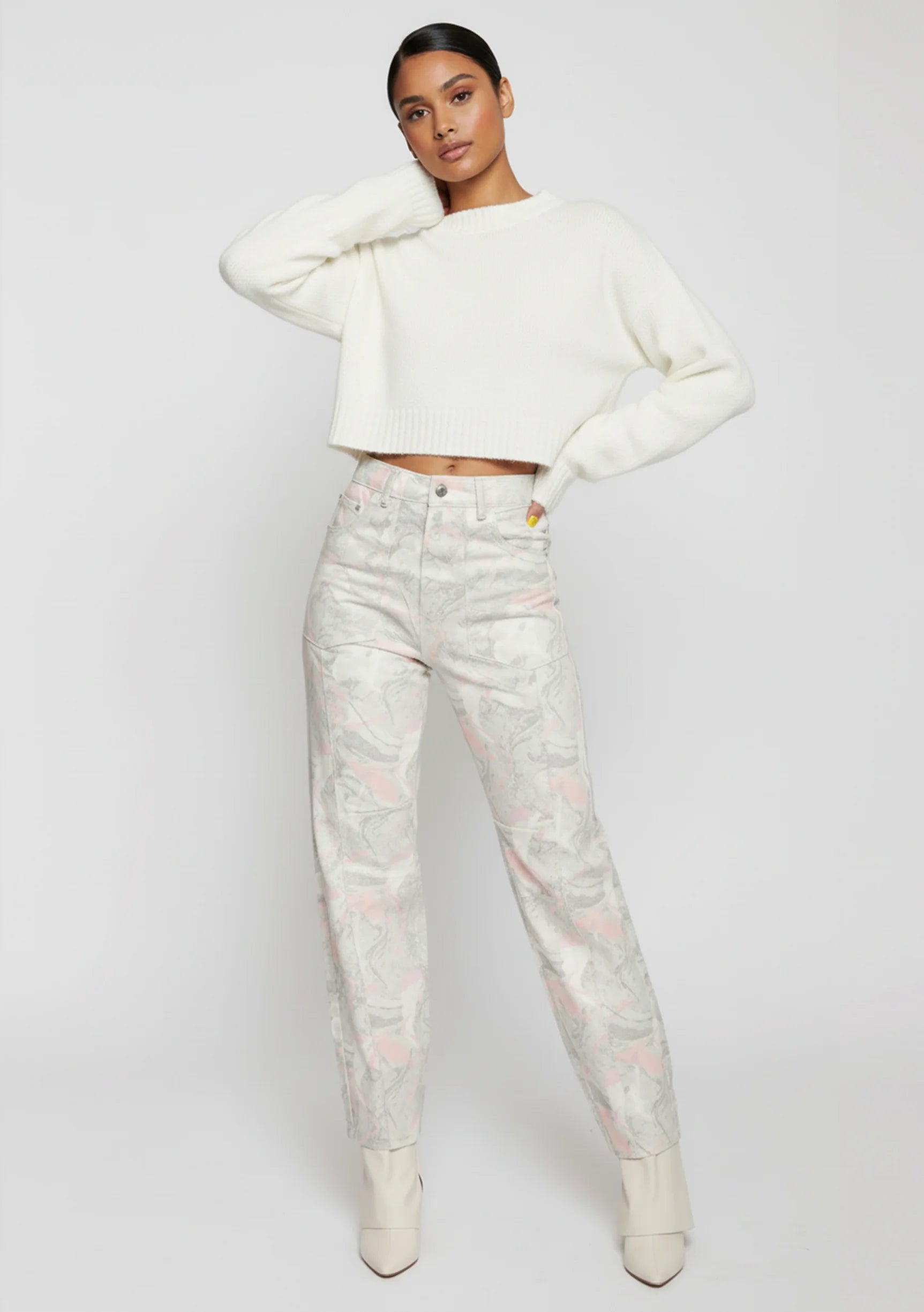 Side profile view of ladies fluid marble tapered pants showcasing the form-fitting silhouette.