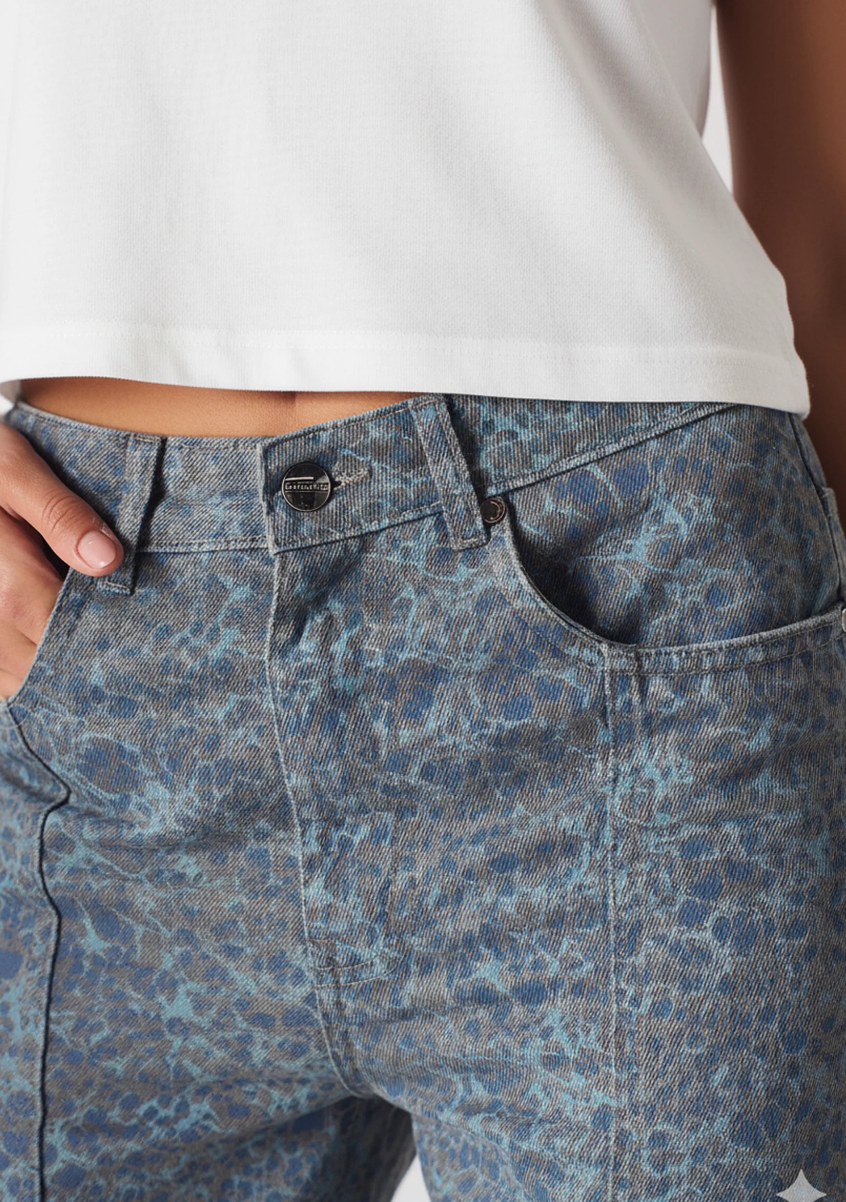 Close up of the front waist and button on Ladies Grey and Dark Blue Speckle Denim