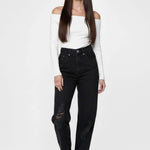 Front facing view of a model in Ladies Straight Fit Black Denim Jeans paired with white sneakers