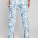 Full back view of a model wearing ladies trippy pattern high-rise jeans with classic back pockets.