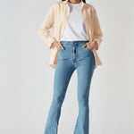 Front view of women's high-waisted light blue bootcut jeans with slip pockets