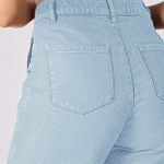 Close up shot of the rear pockets and high-quality denim fabric on the light blue cargo jeans.