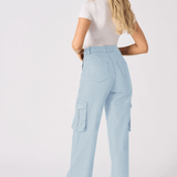 The back view of a woman wearing high-waisted light blue cargo jeans for women showing a flattering fit.