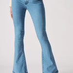 Close up texture view of the front slip pocket on light blue denim jeans