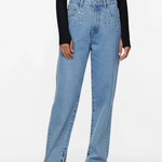 Light blue jeans worn by a person on a white background