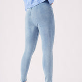 A side-back view of the light blue jeggings for women showing the secure fit and high-quality denim look.