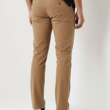 Back pocket and fit details of mens light brown pants