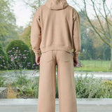 Back view of a model in the men's beige wide-leg joggers