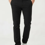 Front detail view of mens black slim fit trousers with hands in pockets.