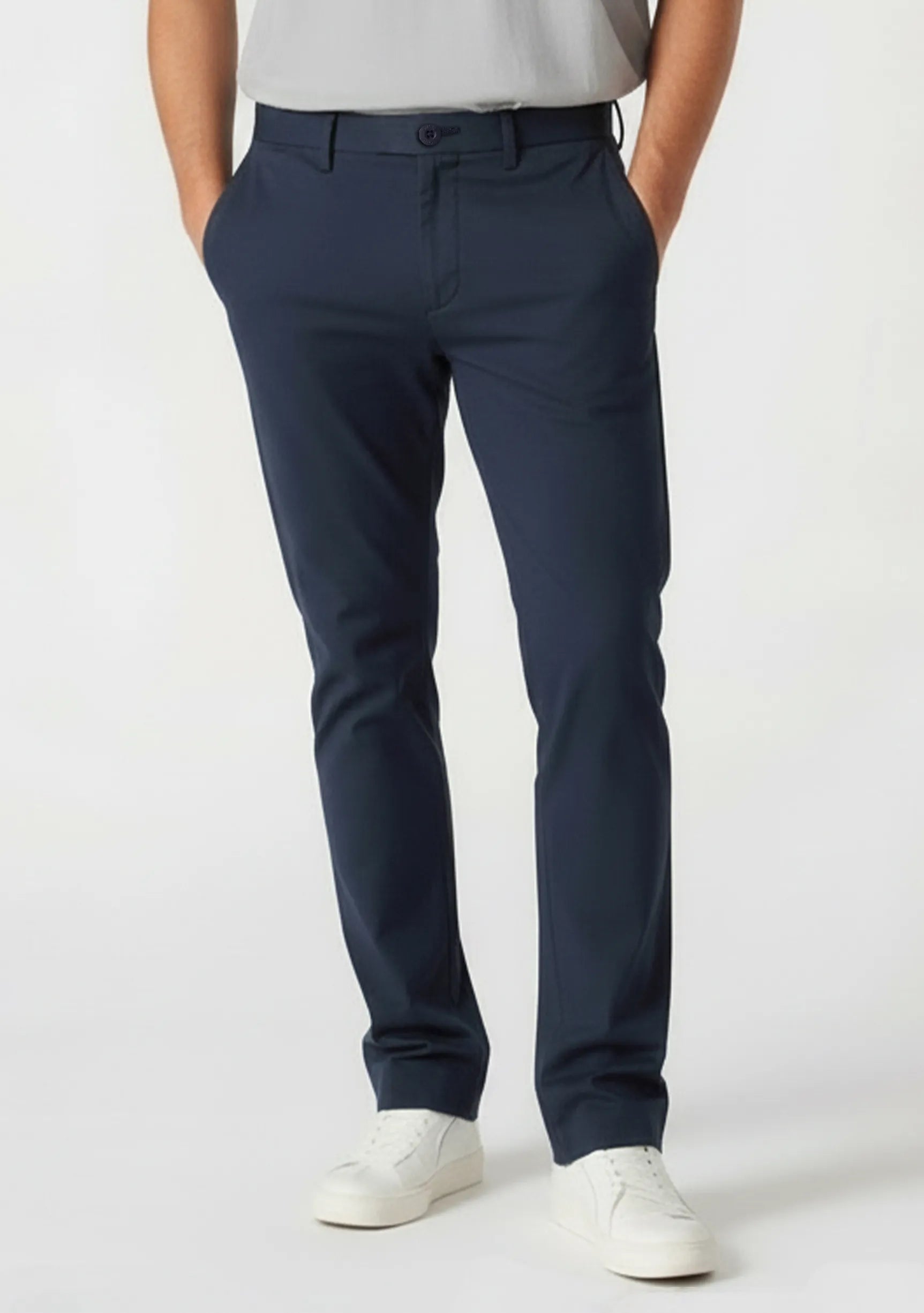 Close-up front detail of mens blue chino trousers showcasing the tailored slim fit.