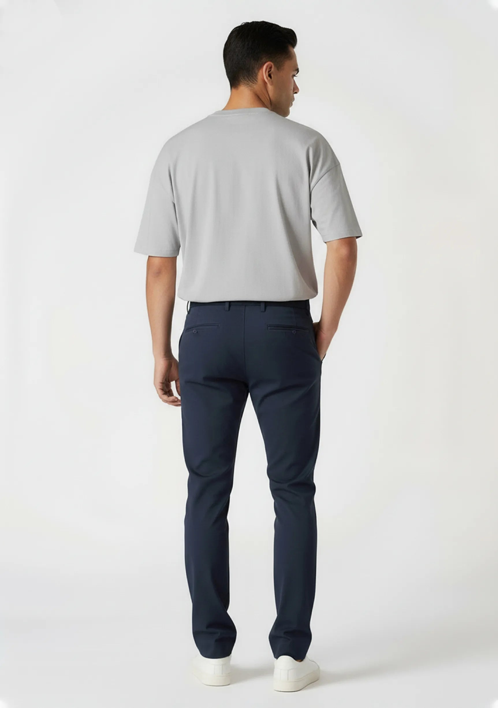 Rear view highlighting the comfortable stretch fit and pockets of mens blue chinos.