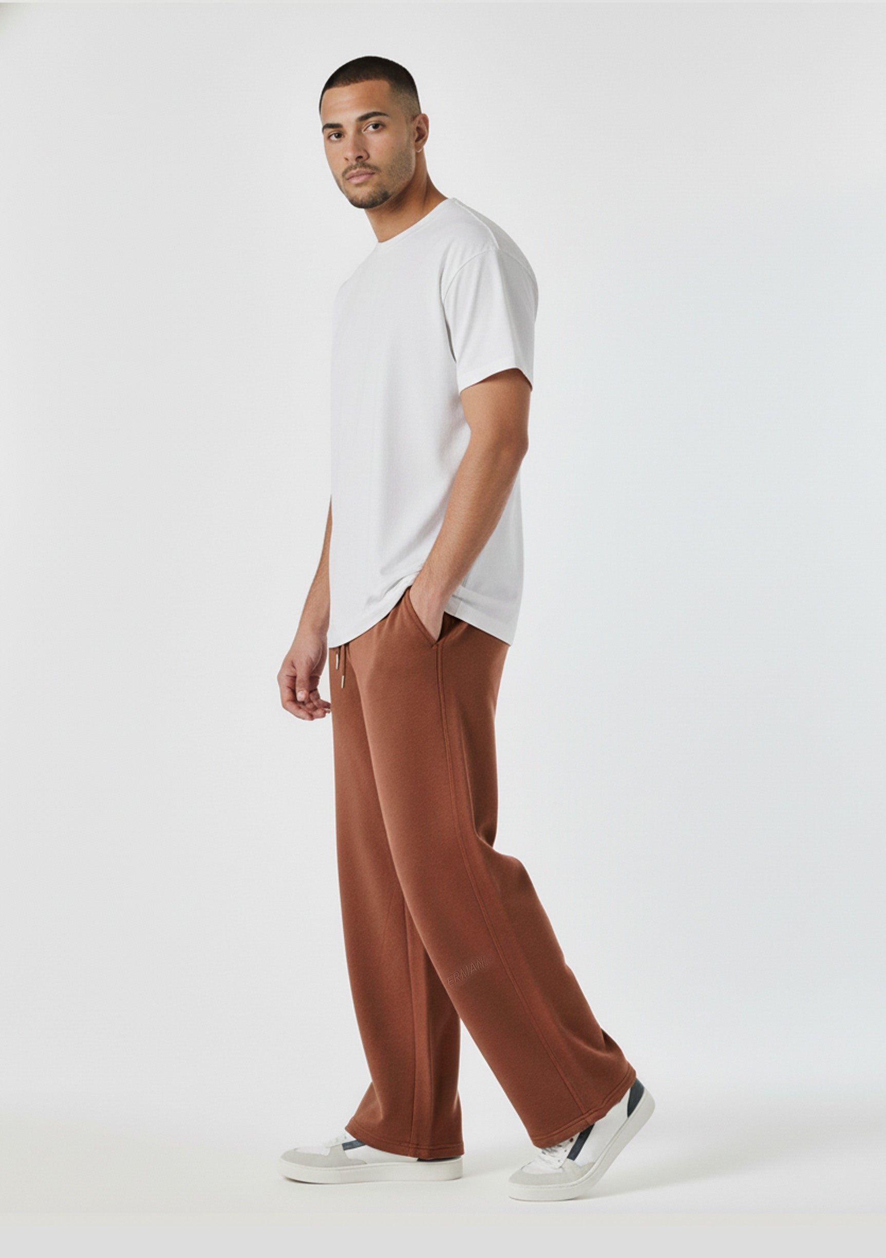 Mens brown wide leg joggers angled front view